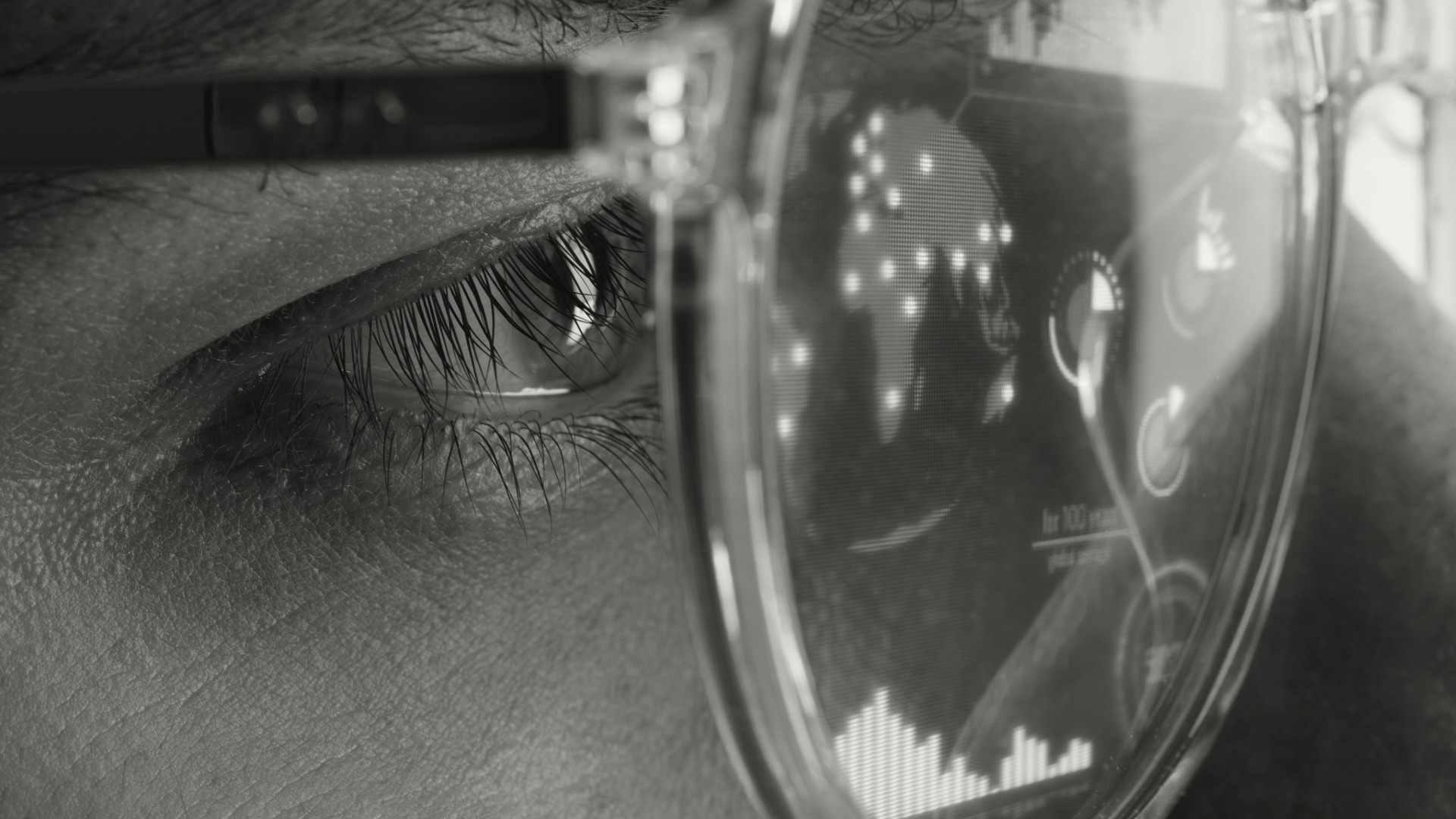 Close-up of an eye with data reflections in glasses — Eyecosystems human-verified accessibility data
