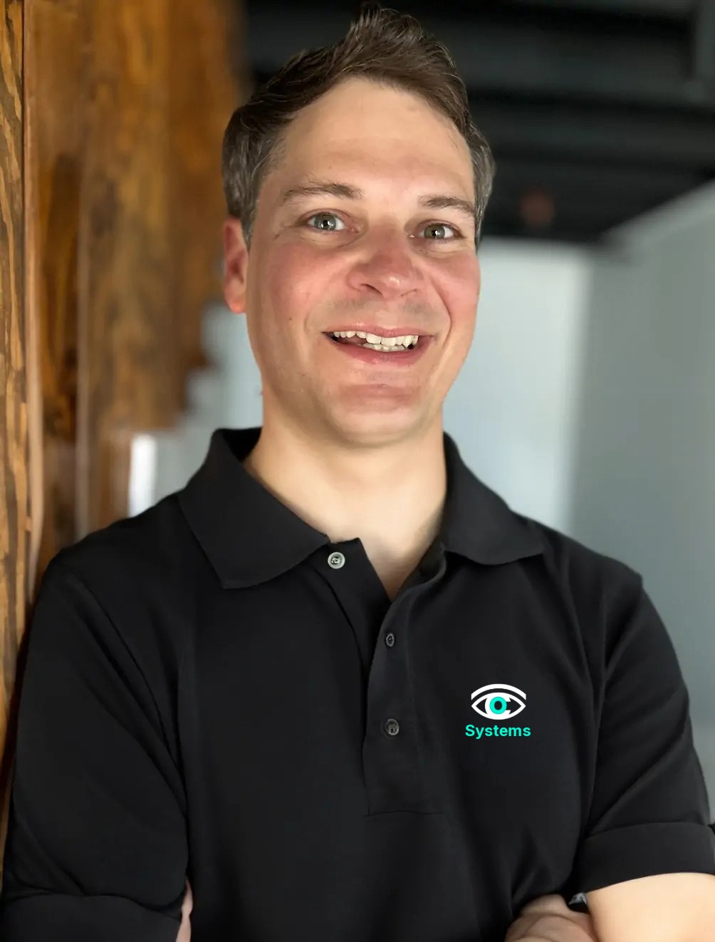 Nick Mendler, Founder of Eyecosystems, wearing a black Eyecosystems polo